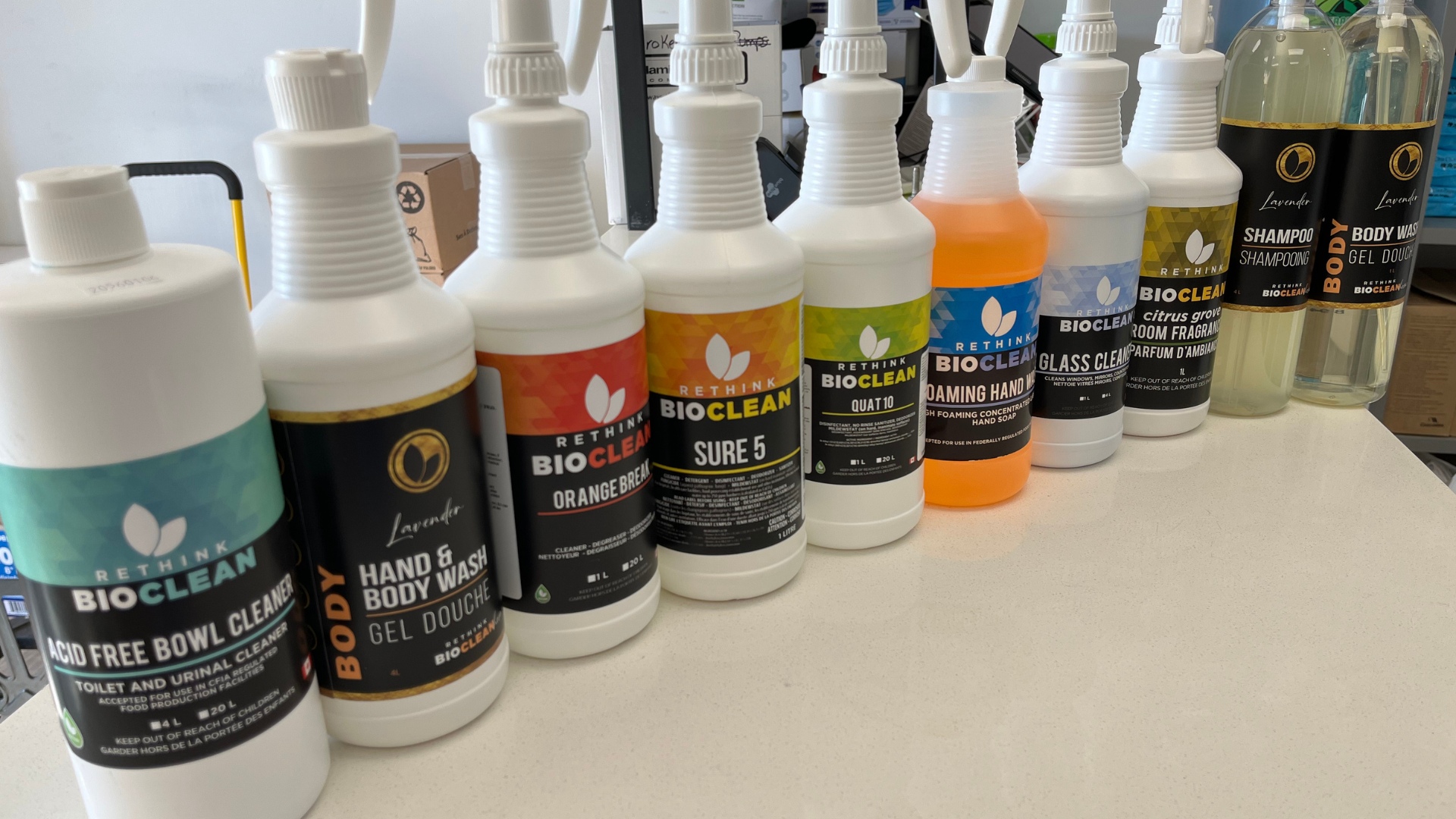 Various ReThink BioClean's chemicals in smaller bottles with colourful labels.
